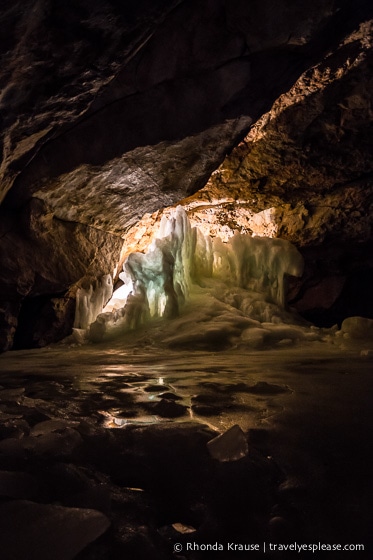 Dark section of the cave with some illuminated ice.