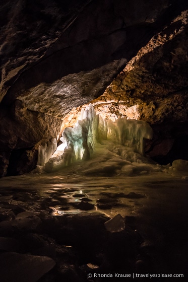 Dark section of the cave with some illuminated ice.