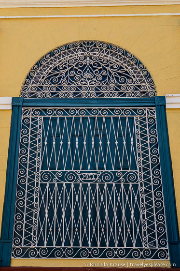 Decorative grille over a window in Trinidad.