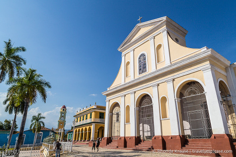 Iglesia Parroquial de la Santisima Trinidad and other buildings surrounding Trinidad's Plaza Mayor.