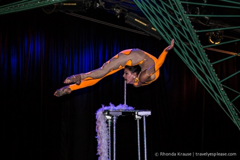 Contortionist balancing on a pole. 