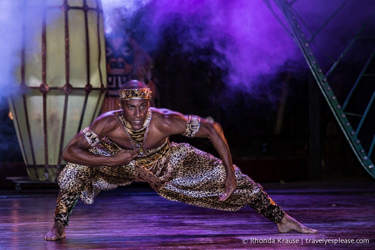 Dancer on stage in a leopard print costume.