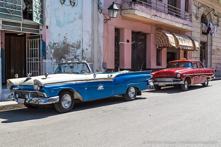 Classic cars parked on the side of the road in Havana.
