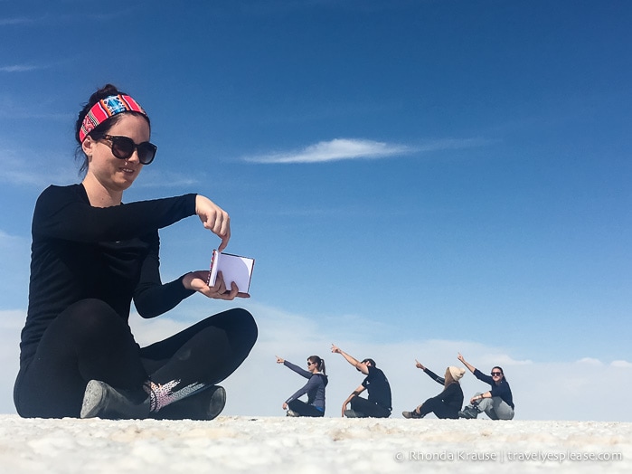 Forced perspective photos are a highlight of Uyuni Salt Flat tours.