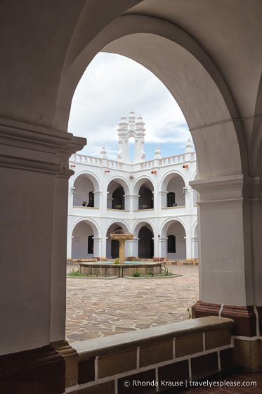 Looking through an arch at Convento de San Felipe de Neri.