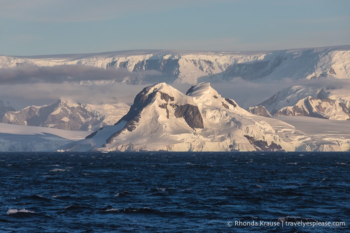 Sunset on glacier-covered mountains in Antarctica