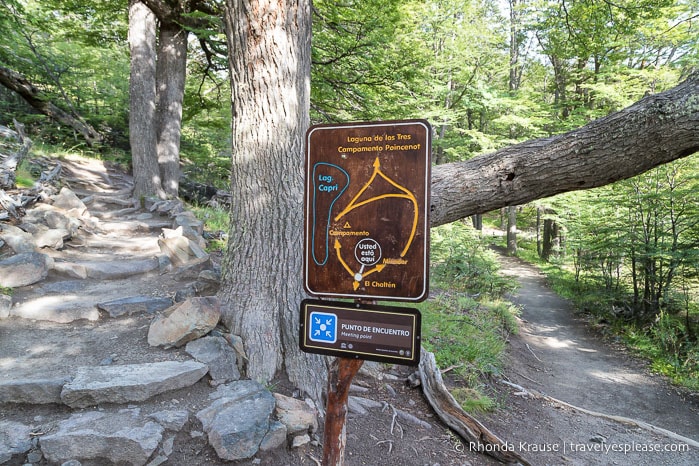 Trail sign at an intersection.