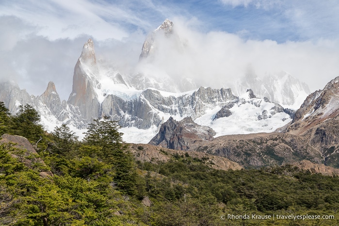 Mount Fitz Roy partially covered by clouds.