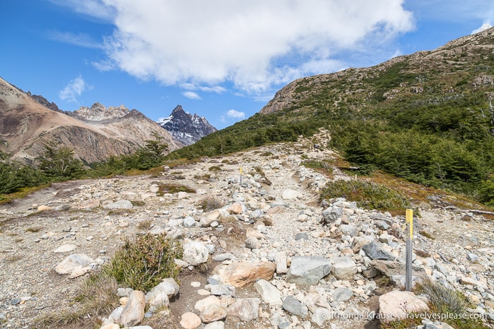 Rocky trail leading to a steep hill.