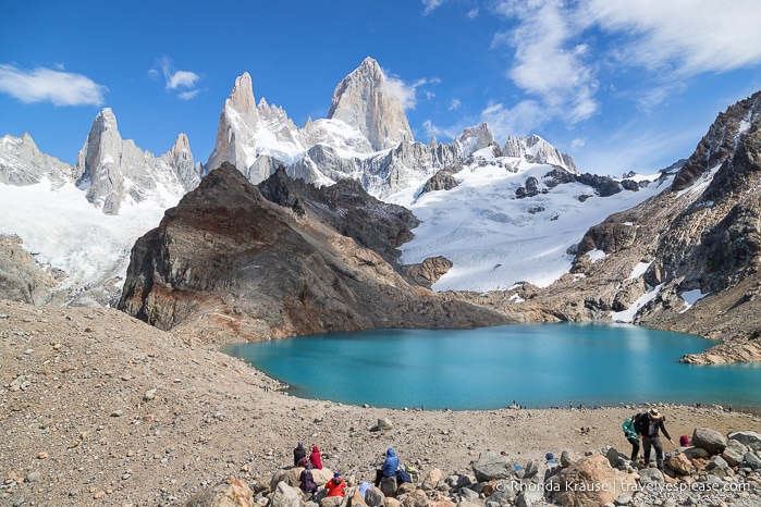 Hikers sitting on the rocks near Mt. Fitz Roy and Laguna de los Tres.