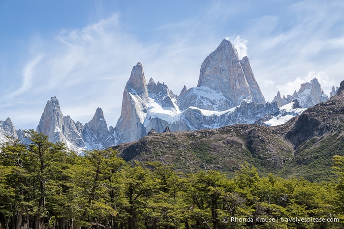 Mt. Fitz Roy overlooking a hill and forest.