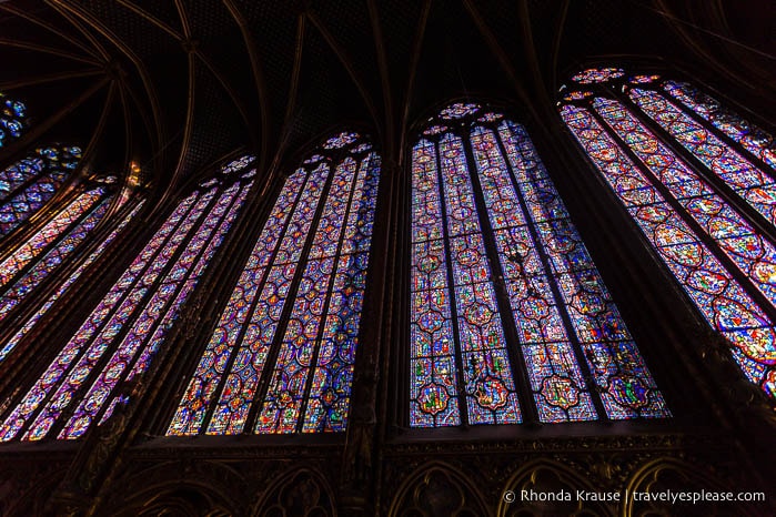 Wall of stained glass inside Sainte-Chapelle.