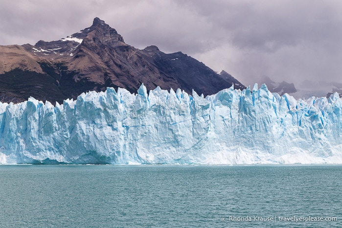 Glacier backed by a mountain, as seen from the boat cruise on Lago Argentino.