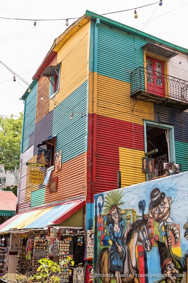 Colourful building, mural and souvenir shop in the Caminito.