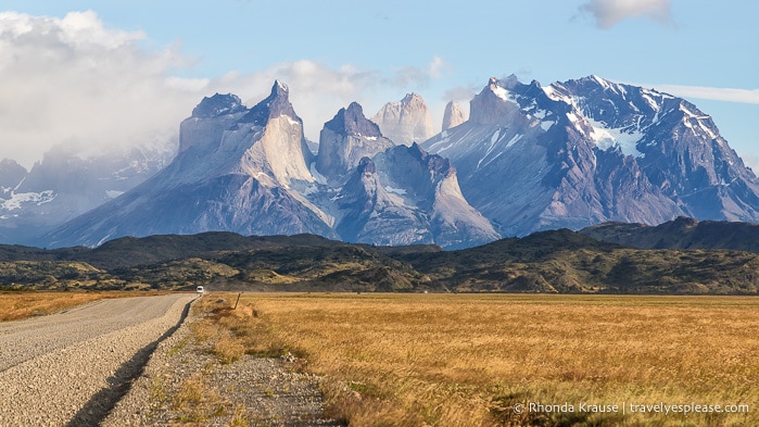 Gravel road leading towards the mountains in Torres del Paine National Park.