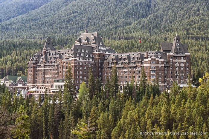 Banff Springs Hotel surrounded by forest.