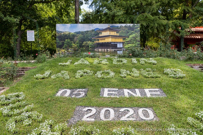 A picture of Kyoto's Kinkaku-ji Temple on display in the garden.