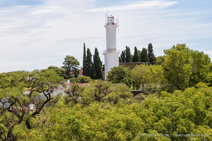 Colonia del Sacramento lighthouse towering over the treetops. 