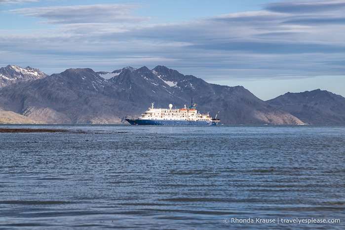 The Sea Spirit Antarctic cruise ship anchored in front of mountains in South Georgia.