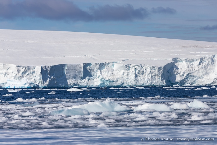 Ice floating in front of a thick glacier.