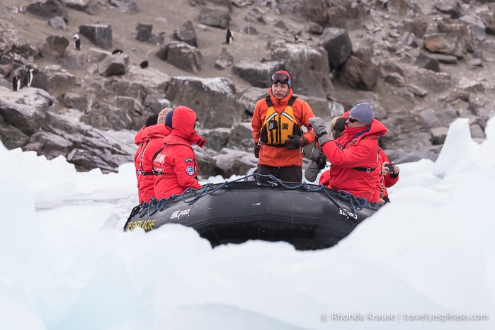 Zodiac cruising along the icy shoreline.