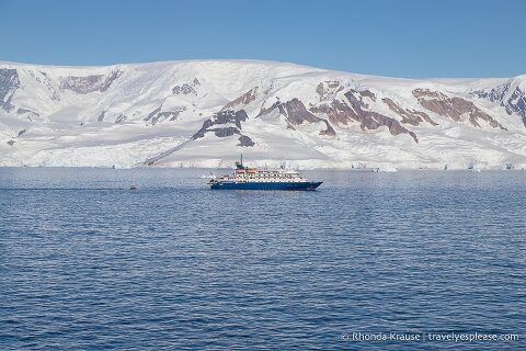 An Antarctica Cruise ship in front of glaciers.