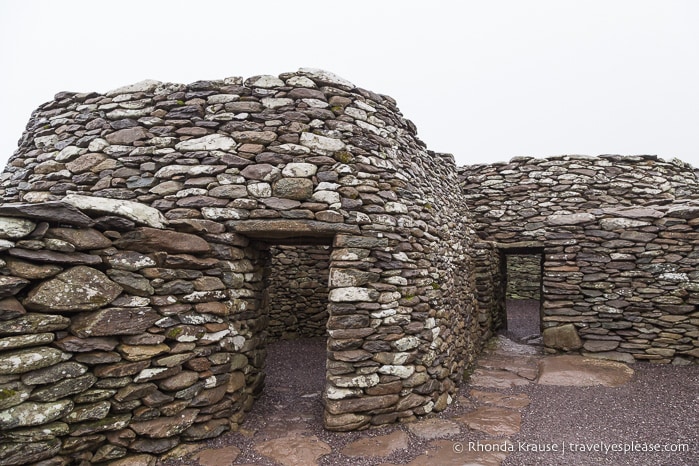 Ruins of two stone beehive huts.