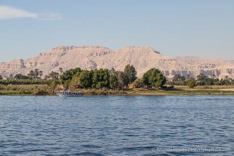 Nile River with a rocky hills in the background.