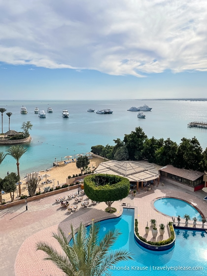 Overhead view of a hotel pool, beach, and the Read Sea in Hurghada.