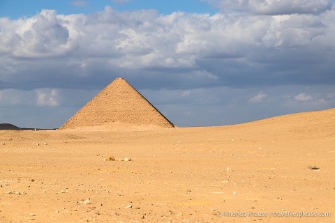 The Red Pyramid surrounded by sand.