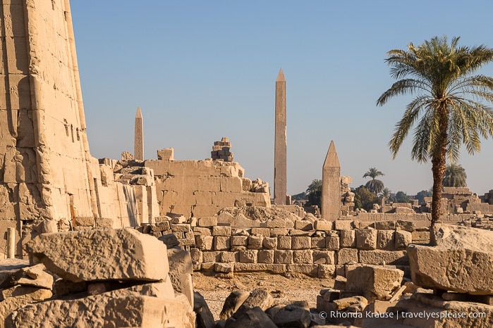 Obelisks and ruined stone walls at Karnak Temple.