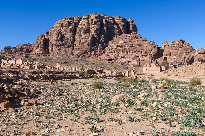 Mountain overlooking some ruins in Petra.