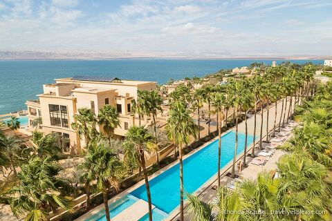 Pool and palm trees at a resort beside the Dead Sea, an enjoyable place to include on a Jordan itinerary. 