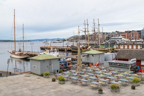 Sailing ships and an outdoor cafe at Oslo’s harbour.