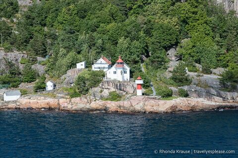 Lighthouse on the rocky shore near Kristiansand.