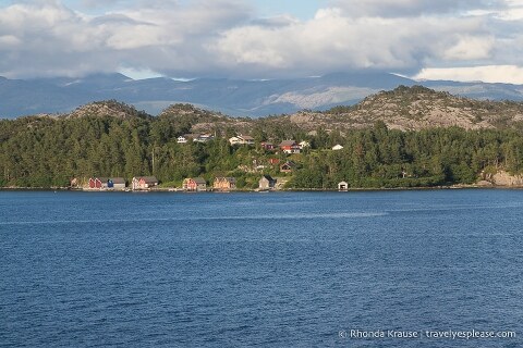 Houses along the shore of Hardangerfjord, Norway.
