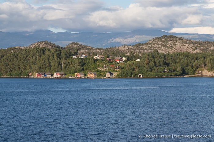 Houses along the shore of Hardangerfjord, Norway.