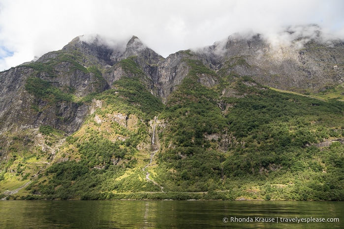 Forested mountain with waterfalls in Nærøyfjord.