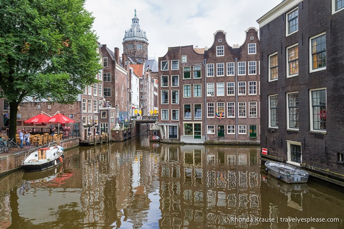 Buildings framing a canal in Amsterdam.