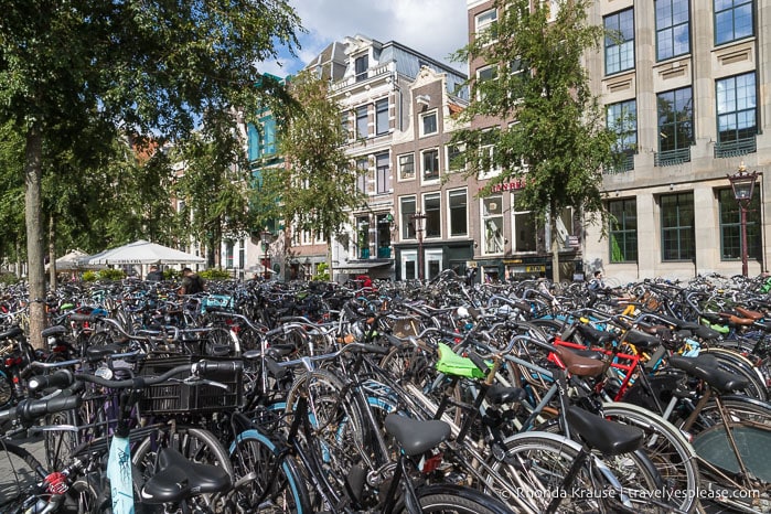 Sea of bikes parked on a sidewalk in Amsterdam.