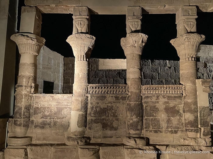 Illuminated columns at Philae Temple at night.