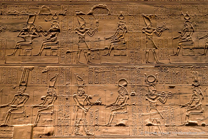 Carvings on the exterior of Philae Temple at night.