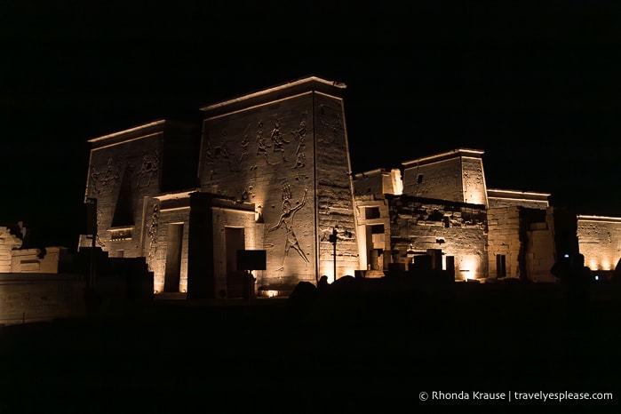 Golden light on Philae Temple at night.