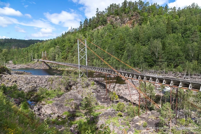 Log chute suspended over the Otra River.