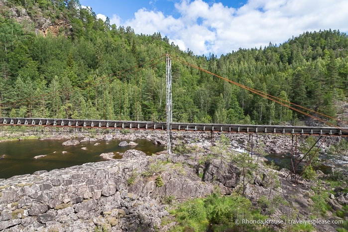 Suspended log chute over the river.