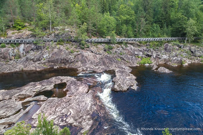 Log chute on the rocky banks of the river.