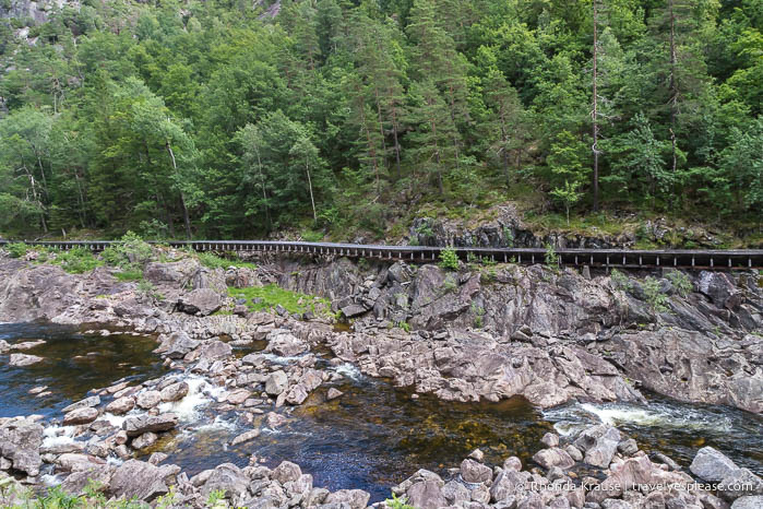 Rocks and log chute beside the river.