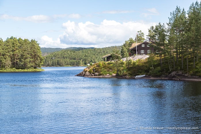 Brown house on a hill overlooking the river.