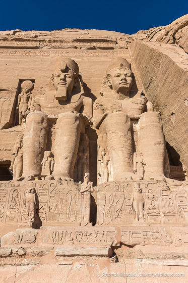 Statues and hieroglyphs on the facade of the Great Temple of Ramesses II.