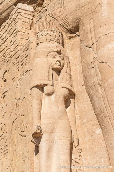 Small statue of a female figure at the feet of Ramesses the Great.